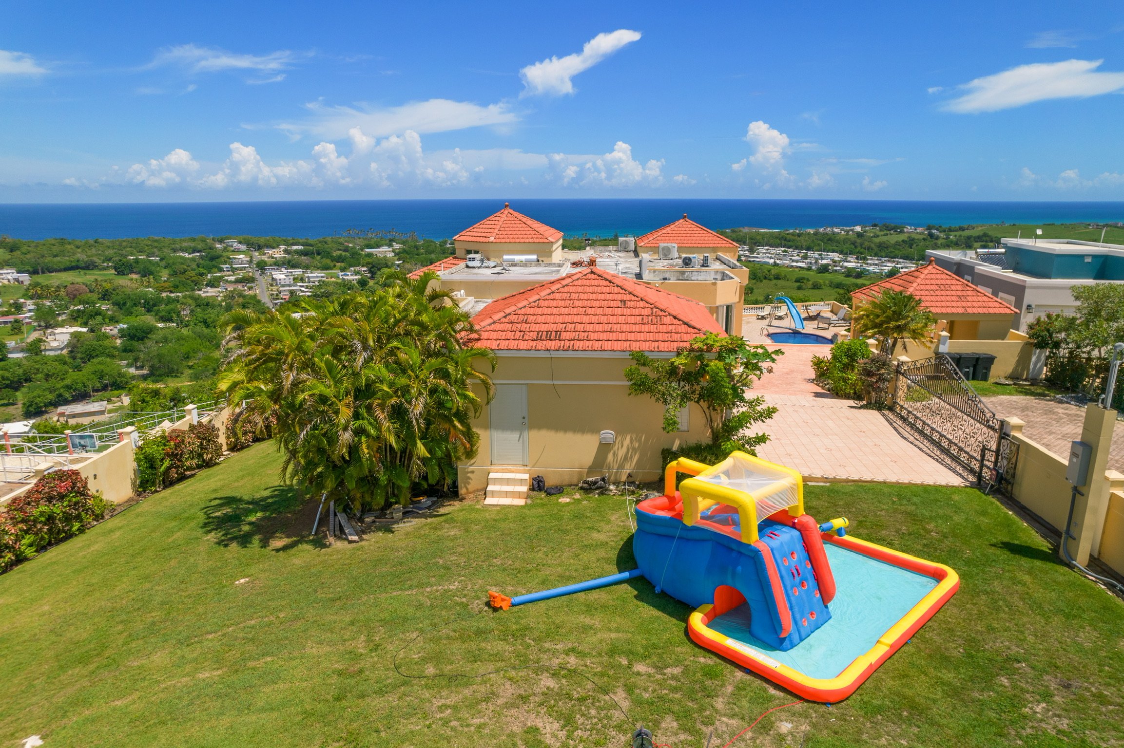 Kids' inflatable mega waterpark on the villa lawn