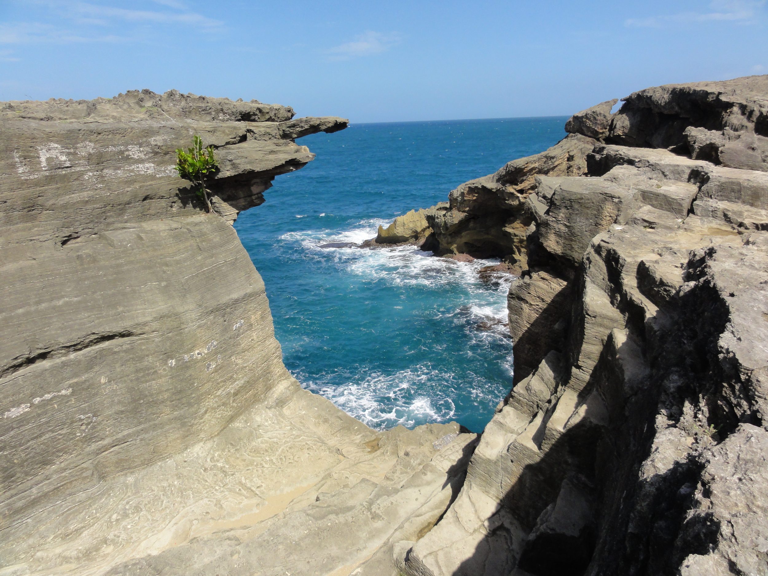 The karst cliffs and sea cave at Cueva del Indio, Arecibo