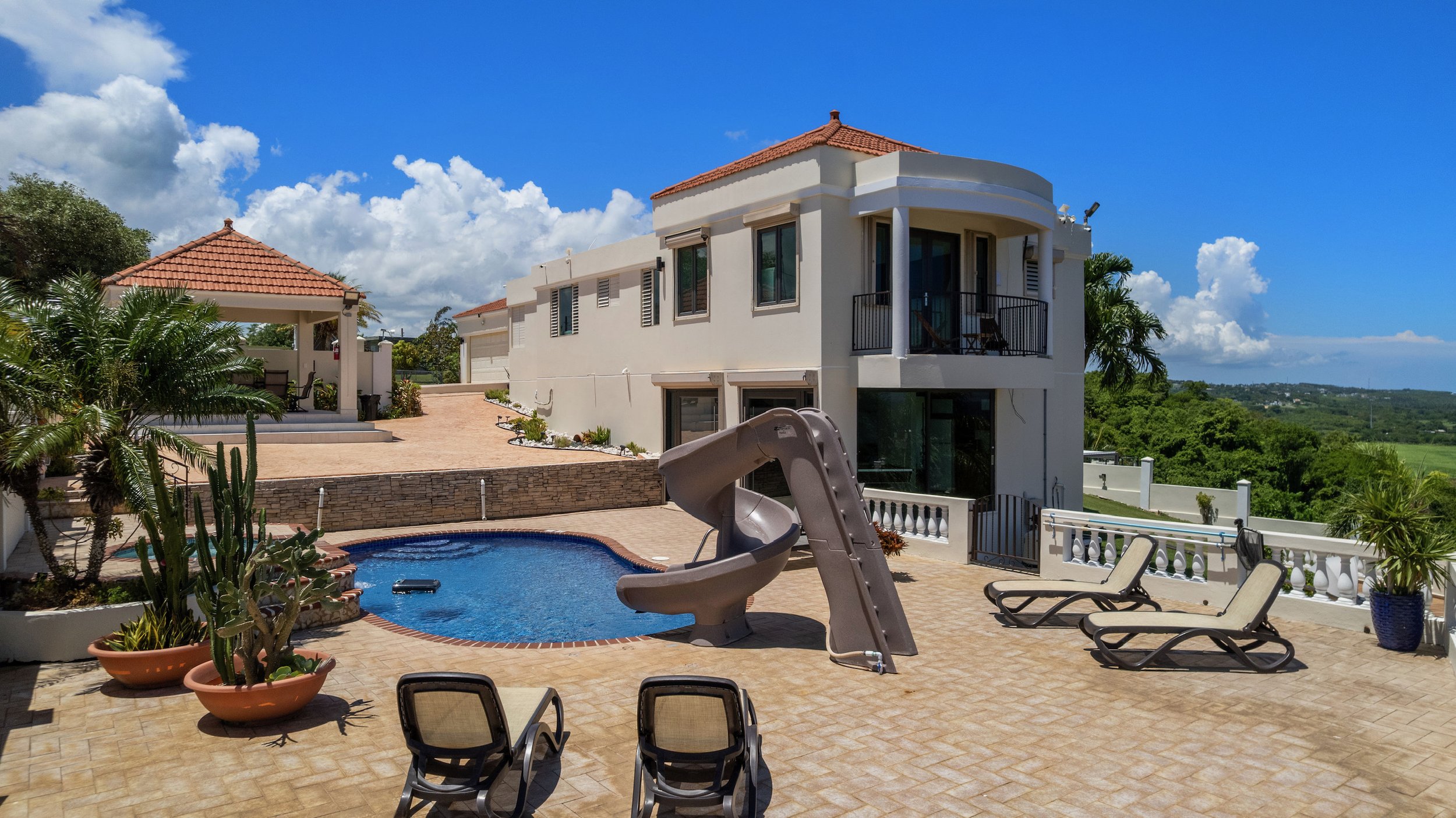 Villa facade with pool and waterslide